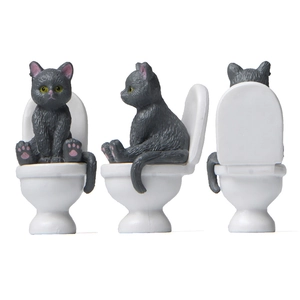 Cat sitting on toilet miniature figurine in grey and white, front, side and back views