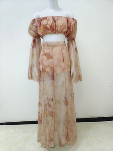 Close-up of floral print crop top and sheer wide-leg pants from two-piece set