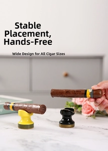 Close-up of ceramic cigar holders in black and yellow with wide grooves and check details