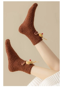 Detail of plush brown coral fleece Christmas socks featuring 3D elk reindeer doll decor
