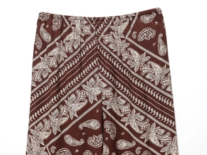 Close-up of elastic waistband on deep brown paisley print casual summer trousers