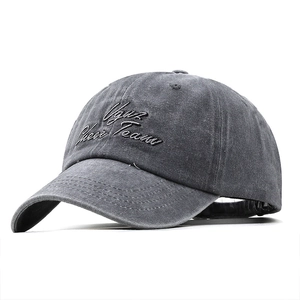 Retro embroidered washed cotton baseball cap in dark grey shown from a 45-degree angle