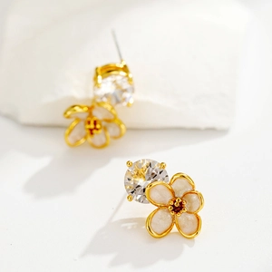 Elegant gold flower stud earrings with white petals and sparkling round crystal stone