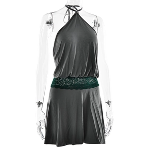 Detail of grey halter mini dress with dark green lace patchwork waist on mannequin