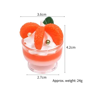 Mini orange sundae ice cream keychain pendant with cream and pearls on white background