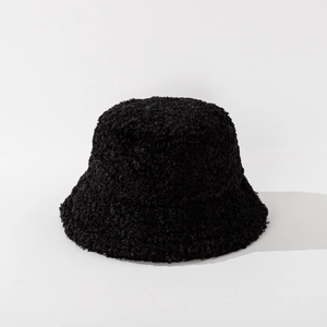 Close-up of black plush bucket hat showing thick fuzzy texture for winter warmth