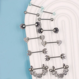 Detailed collection of blue stainless steel nipple rings with heart and moon designs