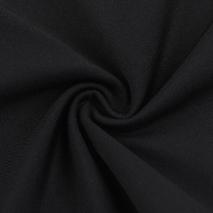 Close-up of the black knit fabric texture showing lace stitching and soft material draping