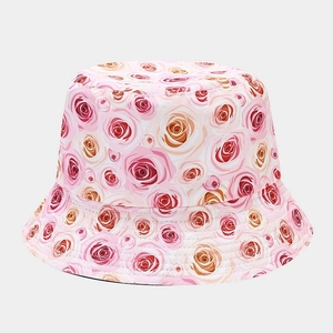 Detailed view of women's bucket hat with vibrant floral rose print and sturdy brim