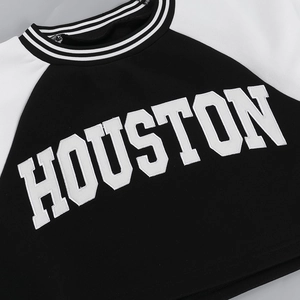 Detail of the Houston letter print and striped ribbed collar on a baseball sweatshirt