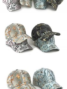 Detailed views of ethnic brocade baseball caps with traditional crane and floral embroidery