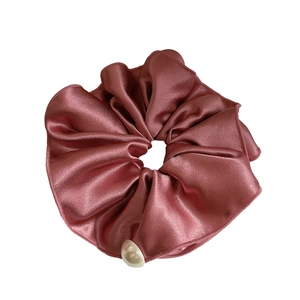 Elegant dusty pink satin scrunchie with a single white pearl accent for women