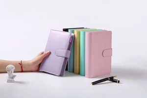 Detailed view of colorful A6 Macaron notebooks with magnetic buckles and PU leather covers