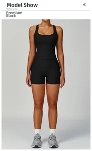 Premium black ribbed yoga set featuring a U-neck tank top and high-waist shorts for fitness