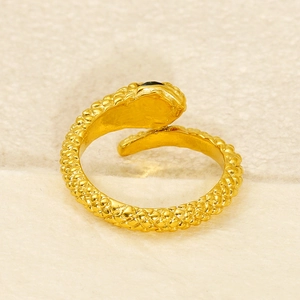Gold snake ring with diamond-pattern scales and dark gem eyes in an open adjustable design