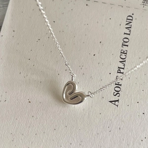 Minimalist 925 sterling silver heart necklace with unique swirling textured pendant