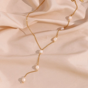 Golden Y-shaped stainless steel necklace with elegant white freshwater pearls on silk
