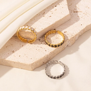 304 stainless steel heart rings with colorful enamel on textured stone and fabric
