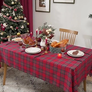 Classic red plaid Christmas table runner on a festive dining table with holiday decor