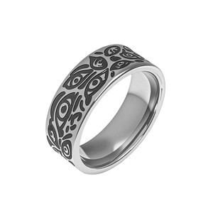 Macro detail of vintage titanium steel wide ring with black gothic eye and vine etching
