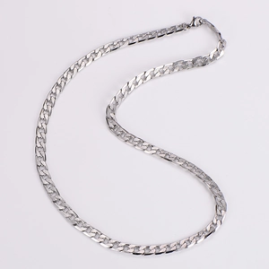 Detail showing the 7mm textured flat curb chain with intricate metallic engravings