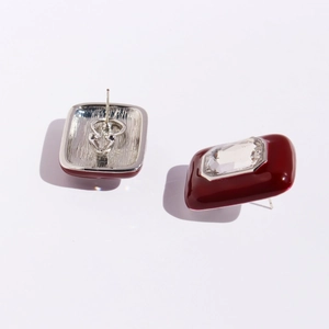 Vintage style square enamel stud earrings in deep red with central transparent gemstone