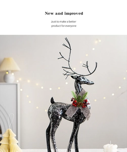 Silver spotted reindeer decoration with brown scarf and festive pine cone details