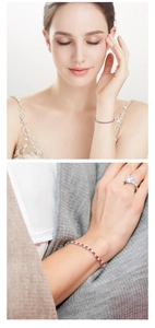 Detail view of 3mm red and white zircon tennis bracelet and matching ring on model wrist