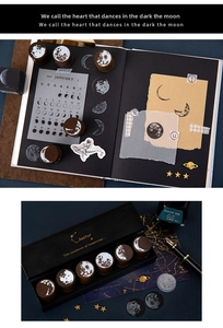Detailed view of vintage moon phase wooden stamp set in an elegant black gift box