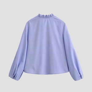 Back view of a lilac poplin long-sleeve blouse with a ruffled high collar and lantern sleeves