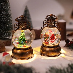 Close-up of retro bronze Christmas lantern water globe with Santa and warm LED lights
