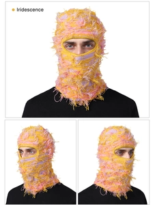 Macro shot of colorful knit balaclava mask with fringe and distressed fringe detail