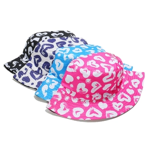 Group shot of heart print bucket hats in black, white, blue, and pink cotton fabric