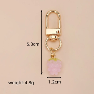 Pink berry fruit pendant keychain with gold metal clasp showing 5.3cm height and 4.8g weight