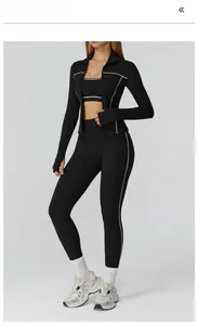 Detailed view of high-stretch yoga set with contrast piping and zipper closure