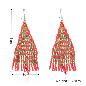 Detail of handmade beaded Christmas tree earrings with dimensions 8cm by 3cm