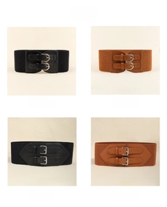 Detail view of elastic waist belts in black and camel colors with stylish metal buckles