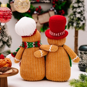 Christmas gingerbread man dolls with knitted texture and festive holiday home decorations