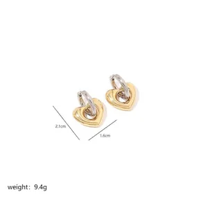 Detailed view of bicolor heart earrings showing precise 2.1cm height and 1.6cm width dimensions