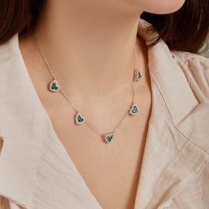 Elegant S925 silver necklace with five hollow heart pendants and green zircons for women