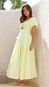 Detail of light yellow cutout dress with bubble sleeves and knot front design