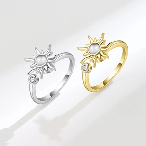 Rotating sunflower anxiety ring in gold and silver finish with moonstone opal inlay