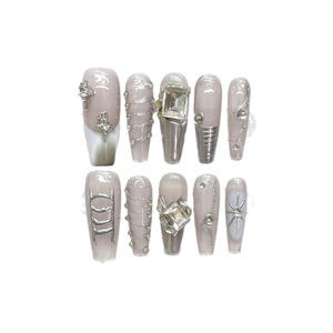 Handmade Y2K press-on nails in silver and grey with 3D stars and sparkling rhinestones