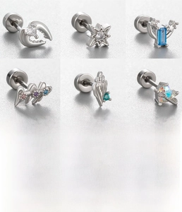 Detail view of silver titanium steel earrings with heart, star, and zircon inlay designs