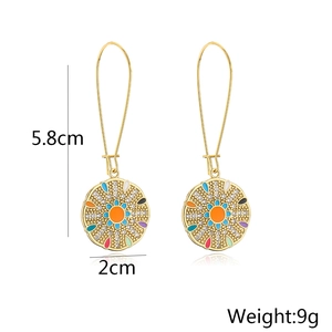 Detail view of 18K gold plated earrings with geometric pendants and size measurements