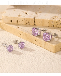 Macro shot of S925 sterling silver lavender stud earrings with four-prong round cut stone