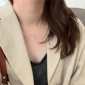 Close-up of minimalist S925 sterling silver geometric circle pendant necklace for women