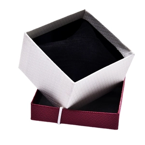 Elegant white and burgundy jewelry gift box with bow and black velvet cushion insert