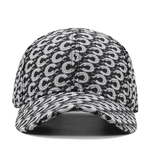 Detailed macro view of the black and white C-letter jacquard pattern on baseball cap
