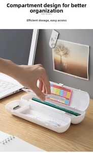 White minimalist plastic pencil box detail showing partitioned slots and a color card